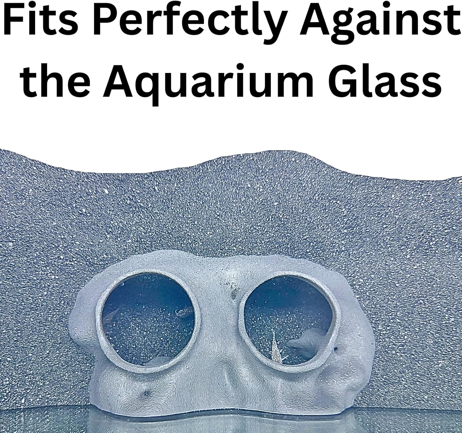 Aquarium underground tree against glass cave that fits perfectly against tank side. 