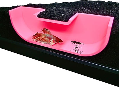 Underground pink betta hideout tunnel cave with betta fish swimming inside of it.