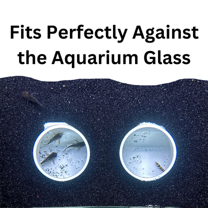 White aquarium cave underground against the fish tank glass to show how it sits under gravel.